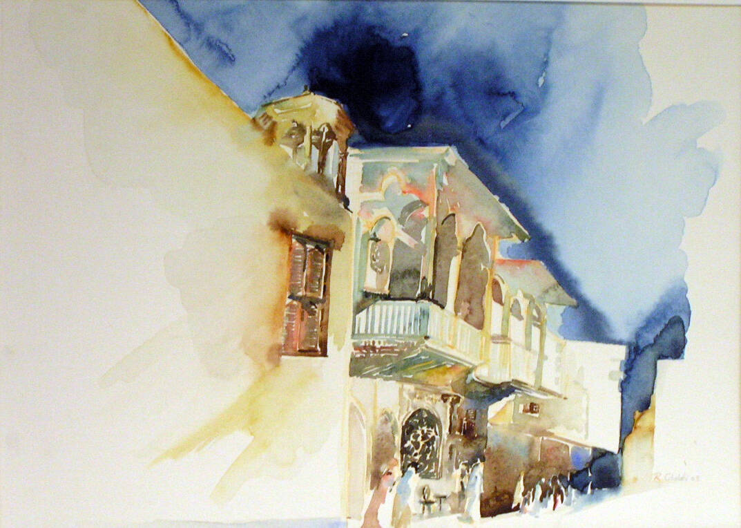Watercolor of a building of shops with balcony. Dark blue sky provides a background to the buildings.